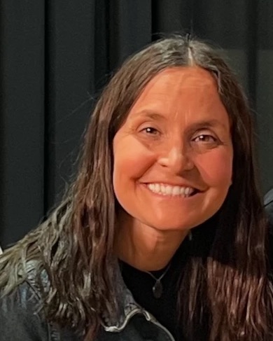 Andrea, smiling